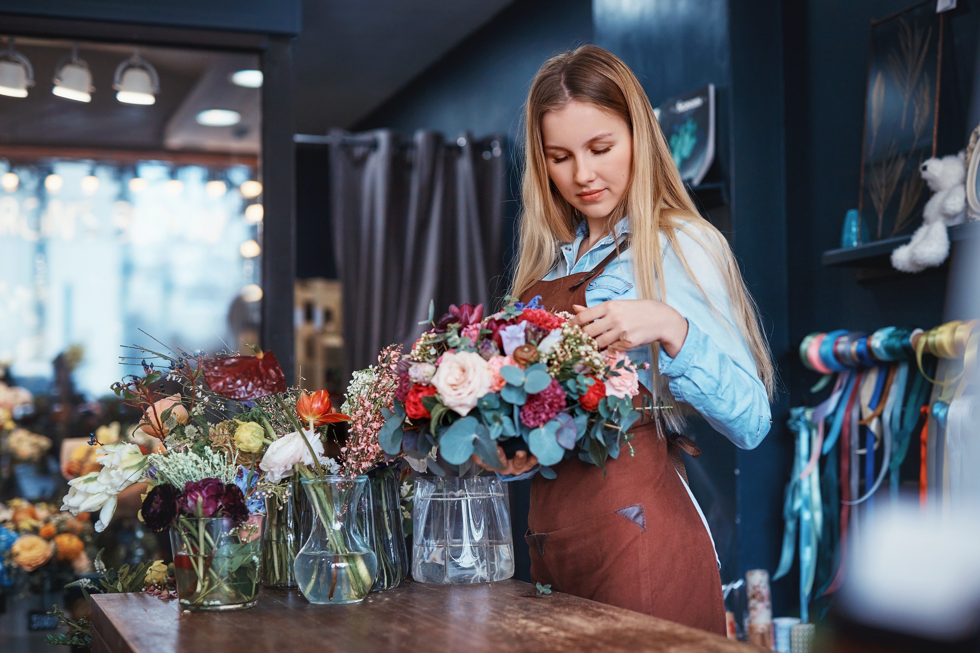 Business owner using ePos equipment in a flower shop
